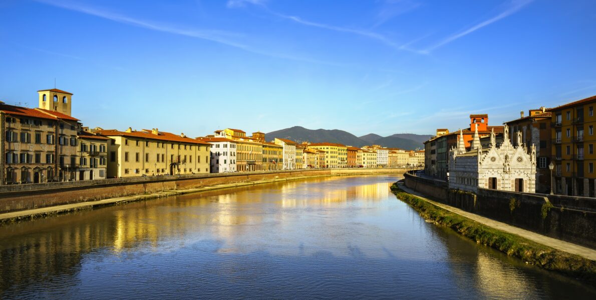 Pisa, Arno river sunset. Lungarno view and Santa Maria della Spi