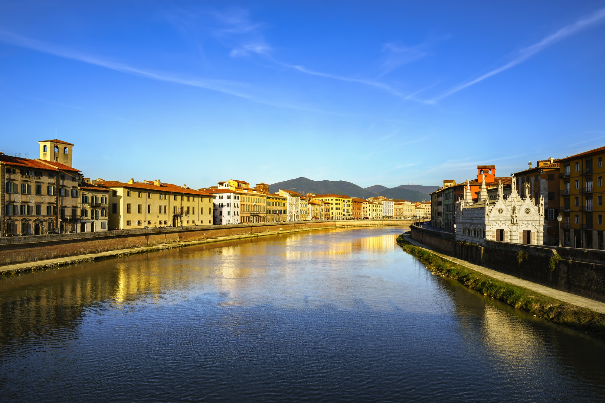 Pisa, Arno river sunset. Lungarno view and Santa Maria della Spi